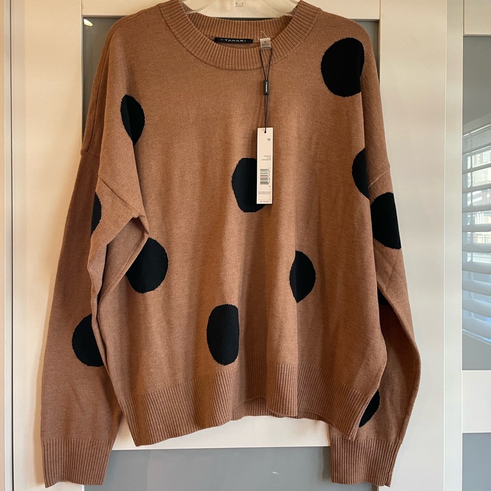 Brown sweater with large black polka dots